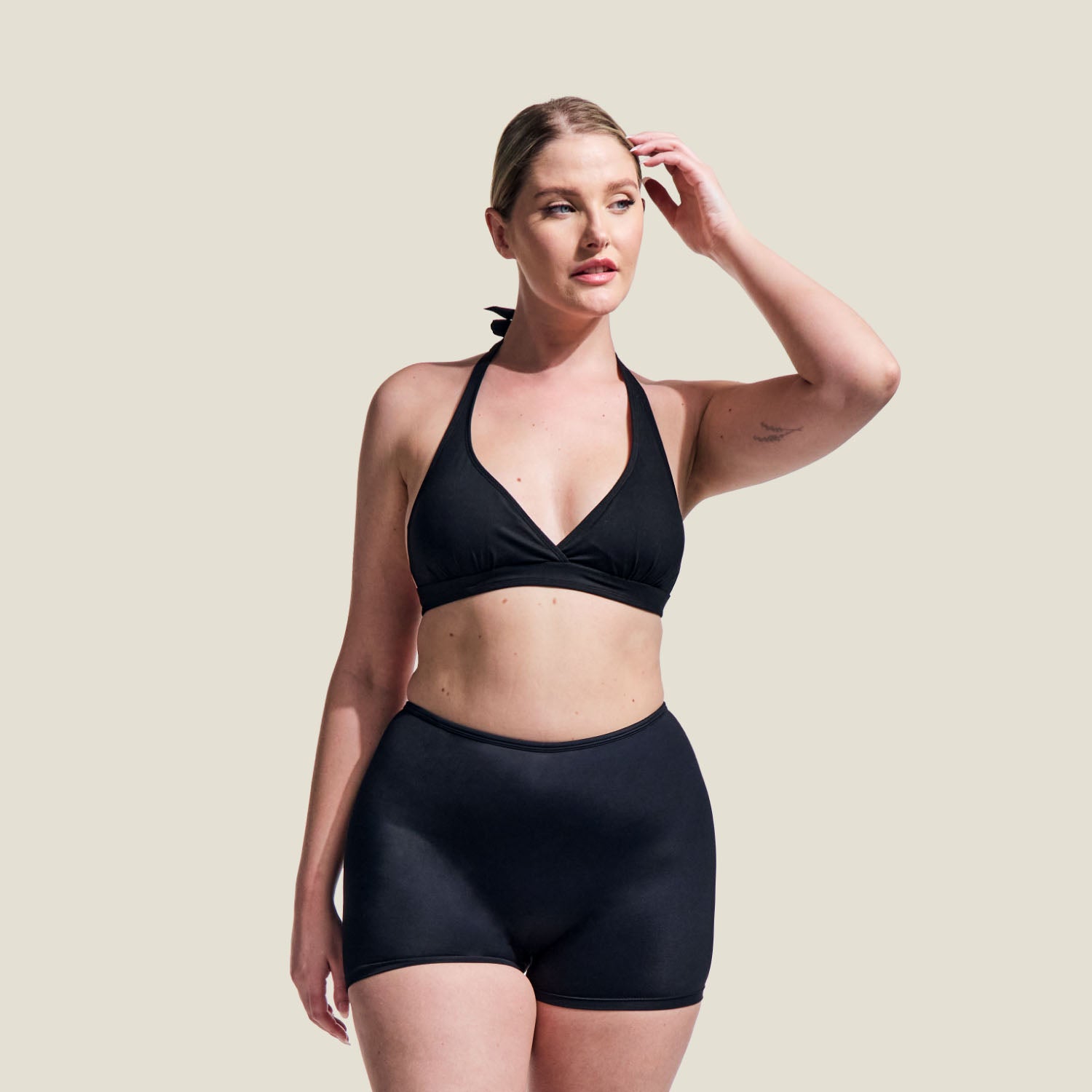 Adult WUKA Period Swim Shorts in black, medium flow, shown in full-length front view on model.