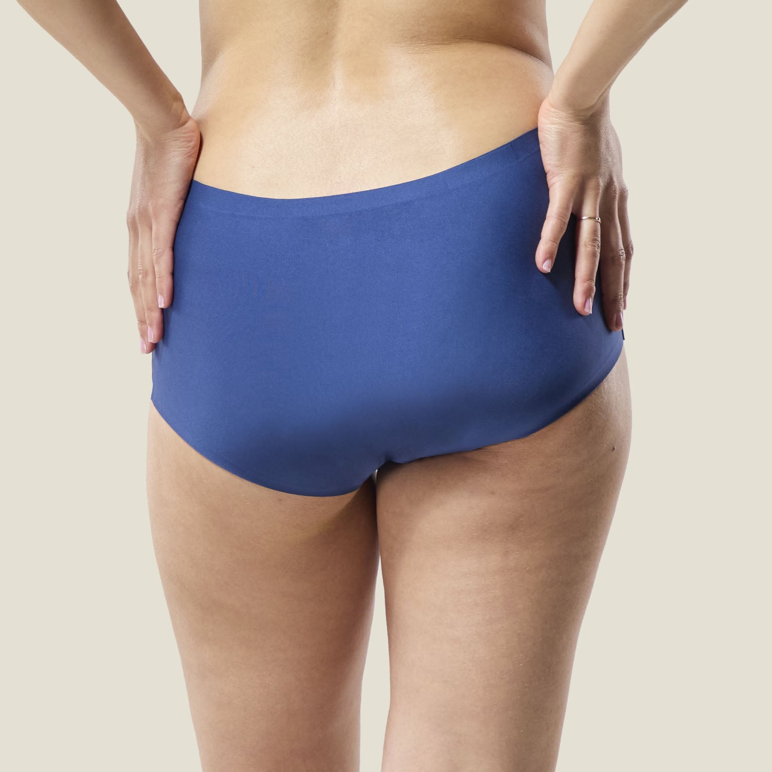 Rear view of Teen Stretch™ Boxer Short in blue, offering full coverage and reliable absorbency for teens during heavy periods.