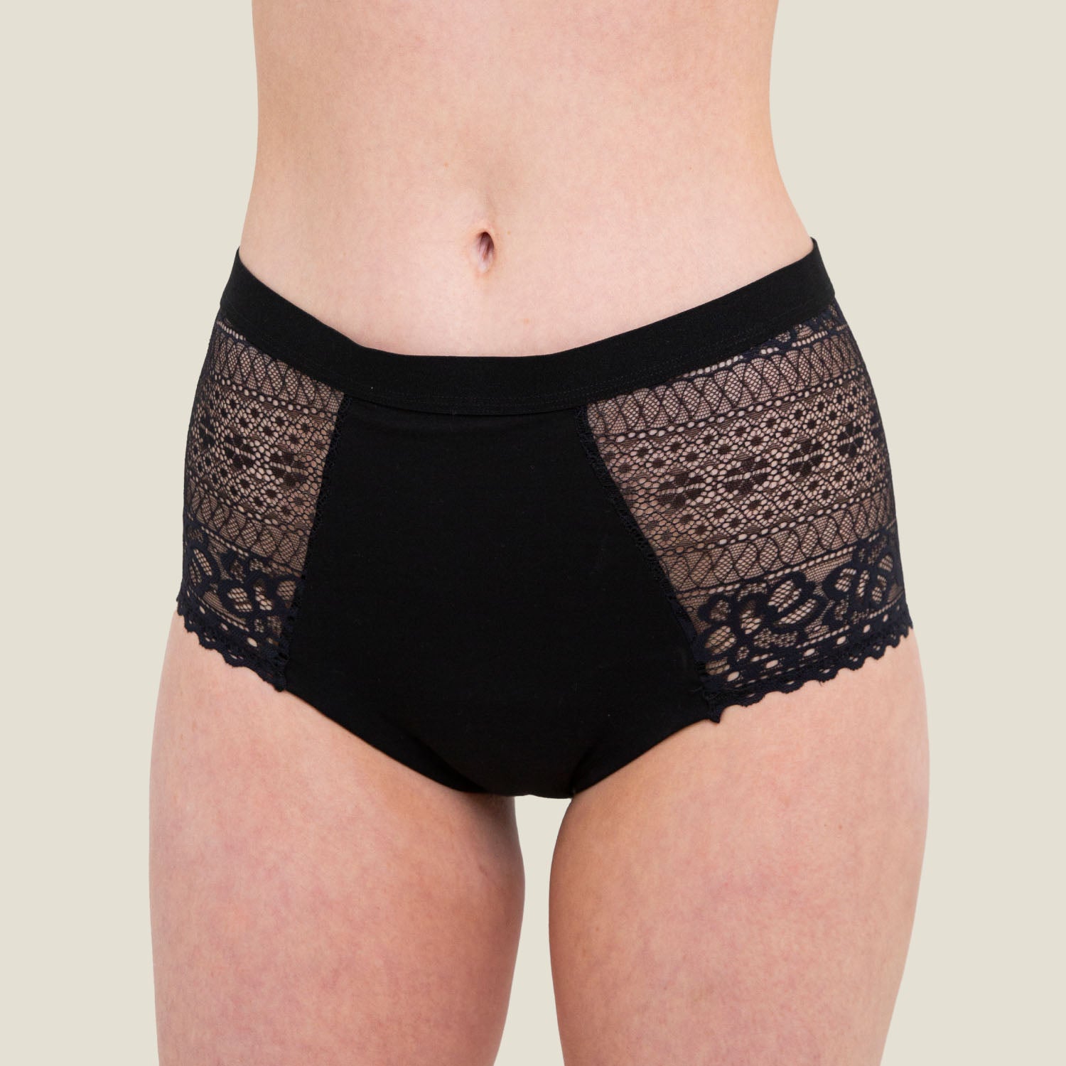 Front close-up of WUKA Ultimate™ Lace High Waist Period Underwear in black, highlighting intricate lace detailing and high waist fit ideal for heavy menstrual flow.