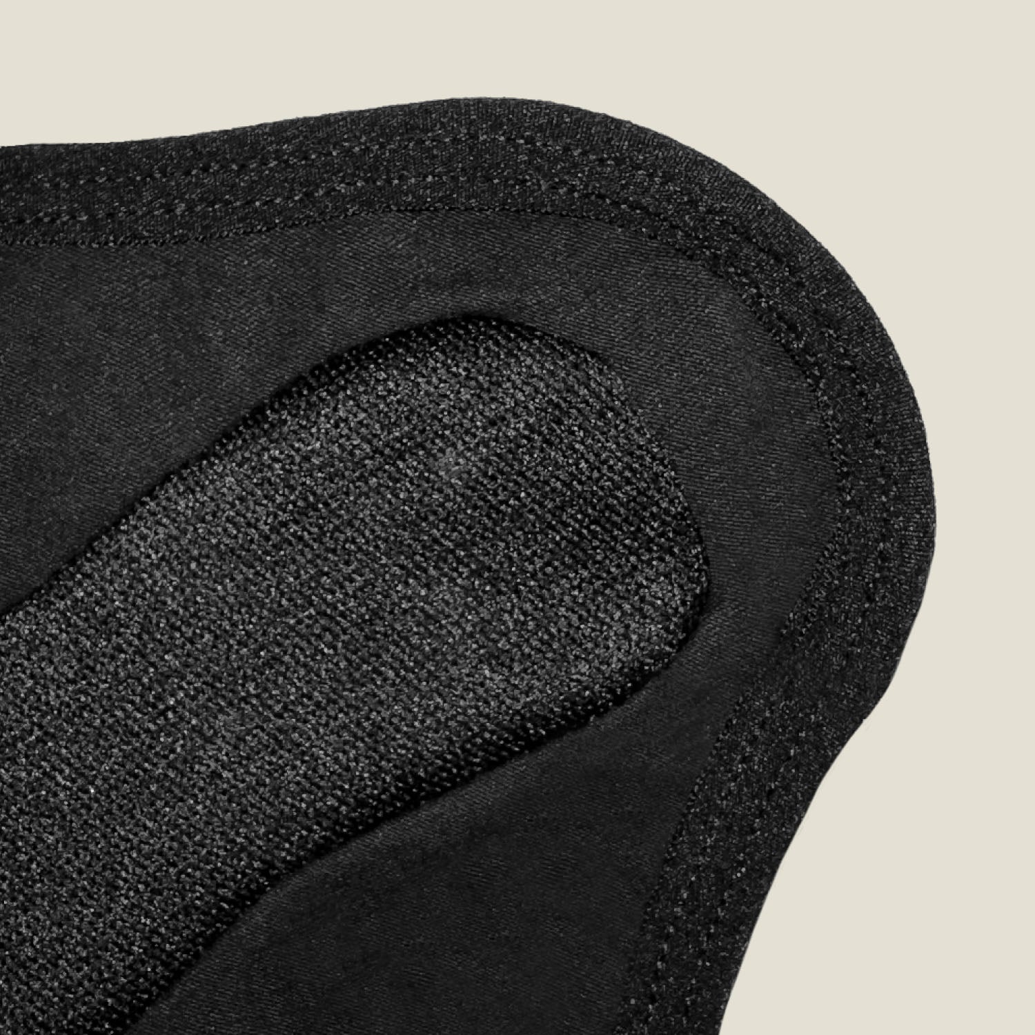 Detailed fabric texture of WUKA light flow reusable panty liner showing super-fast absorption and soft, skin-friendly material.