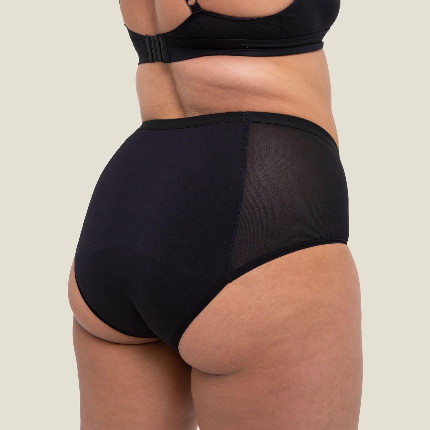 Side profile of WUKA High Waist Period Pants with sleek, supportive fit and mesh panel detailing