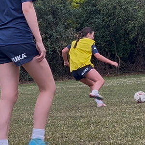 Youth girls’ footballers training in WUKA period-proof shorts, showcasing 5-star club testimonials on confidence, comfort and performance